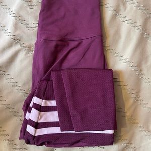 Bombshell sportswear leggings in purple and white.